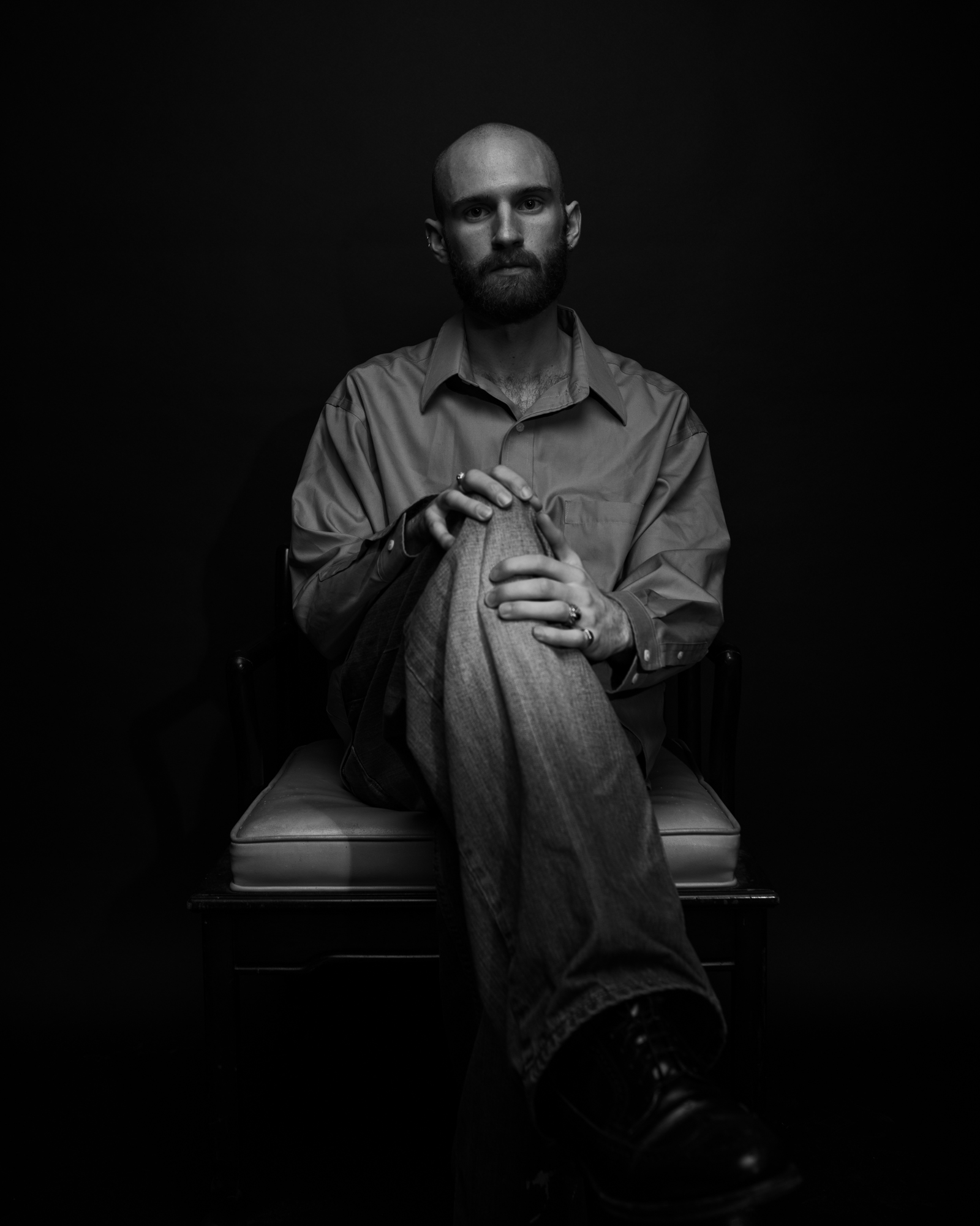 studio portrait of keenan sitting in chair